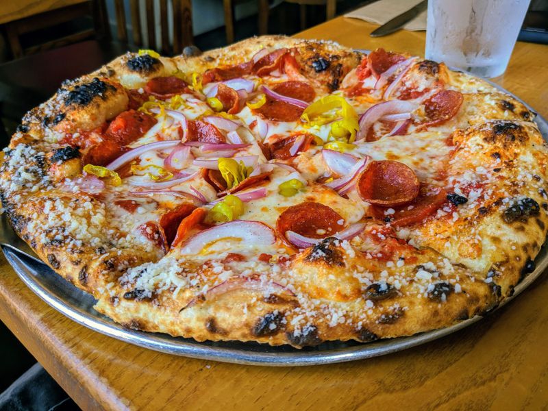 pizzaluce BBQ Chicken pizza with smoked chicken and caramelized onions